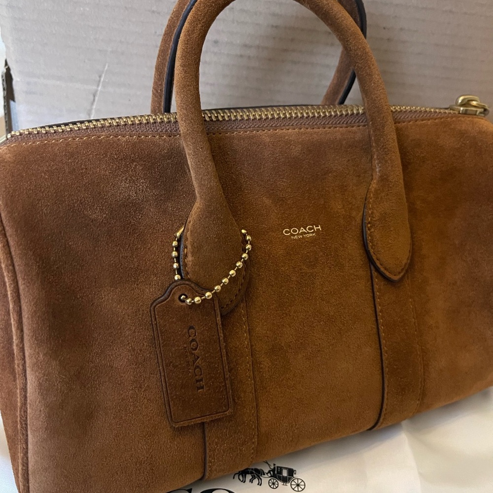 NWT Coach suede compass 25
